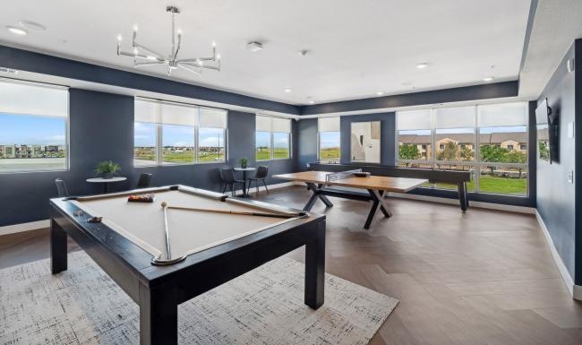 a clubroom with ping-pong and billiards at Ascend at Pena Station