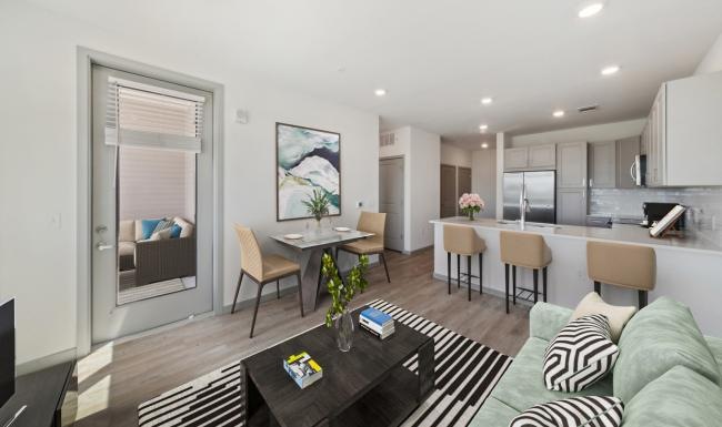 Open space living area with natural lighting at Ascend at Pena Station
