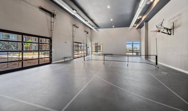 an indoor sports and activities court at Ascend at Pena Station