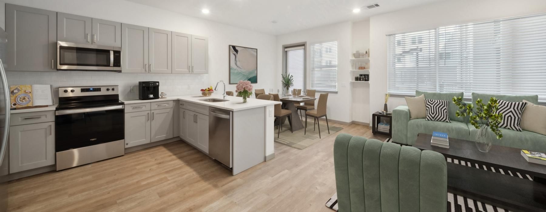 Open space living area with natural lighting at Ascend at Pena Station